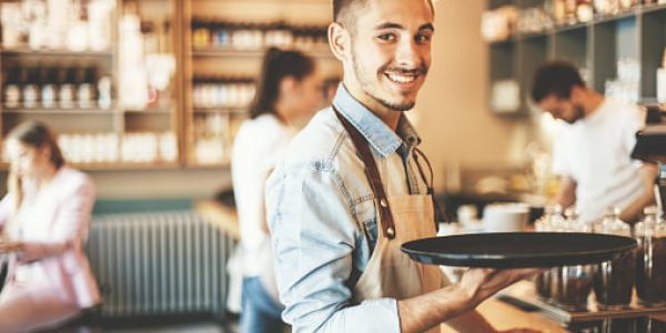 Confident young waiter.